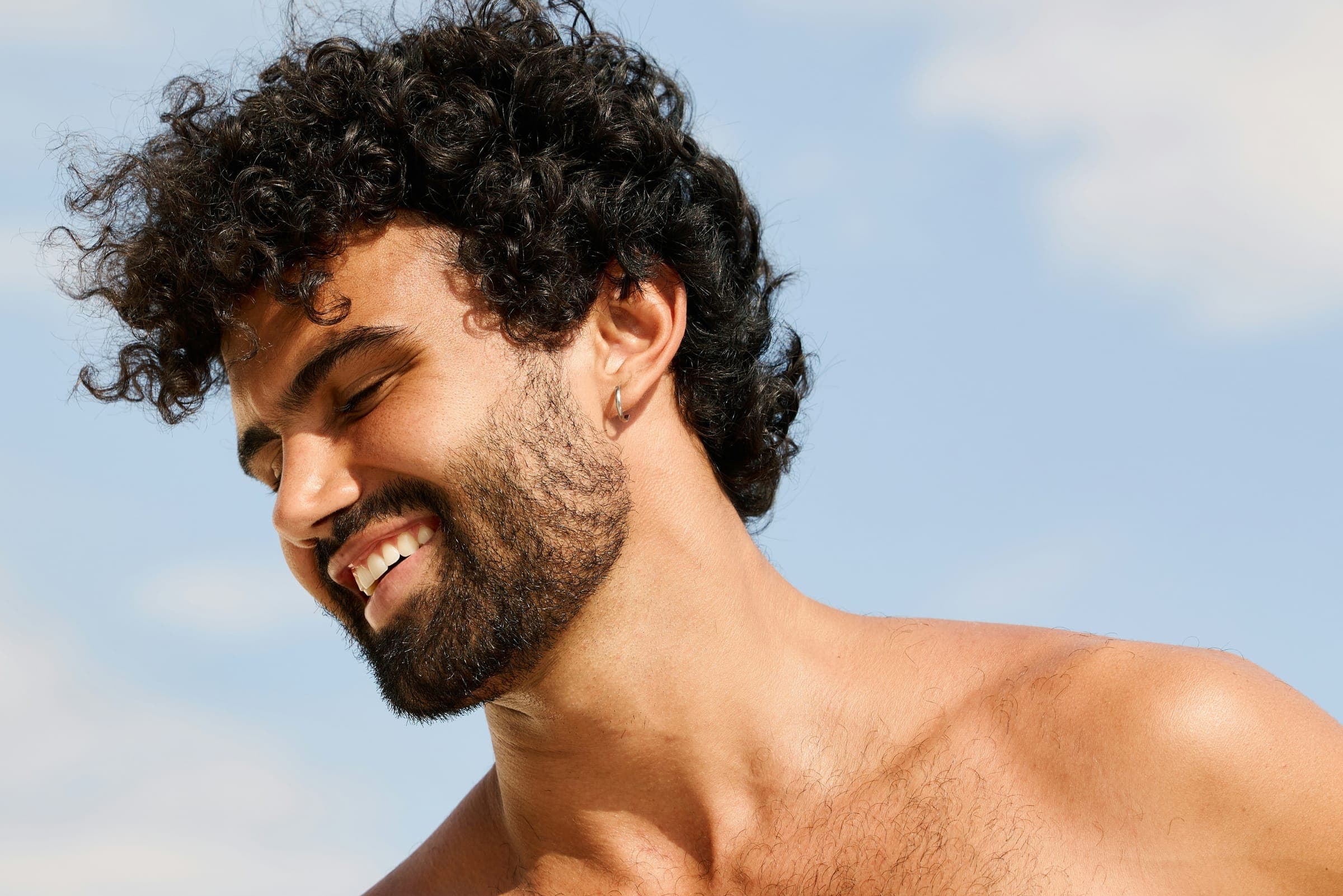 Man with full hair in soft daylight