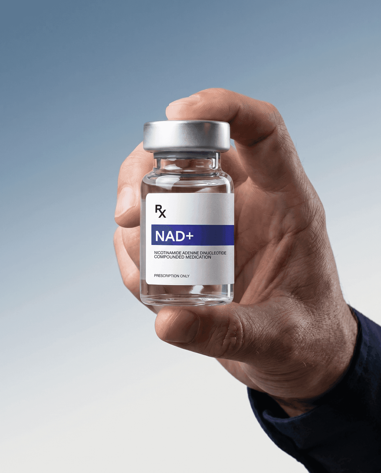 Hand holding a vial of compounded NAD+ Rx solution