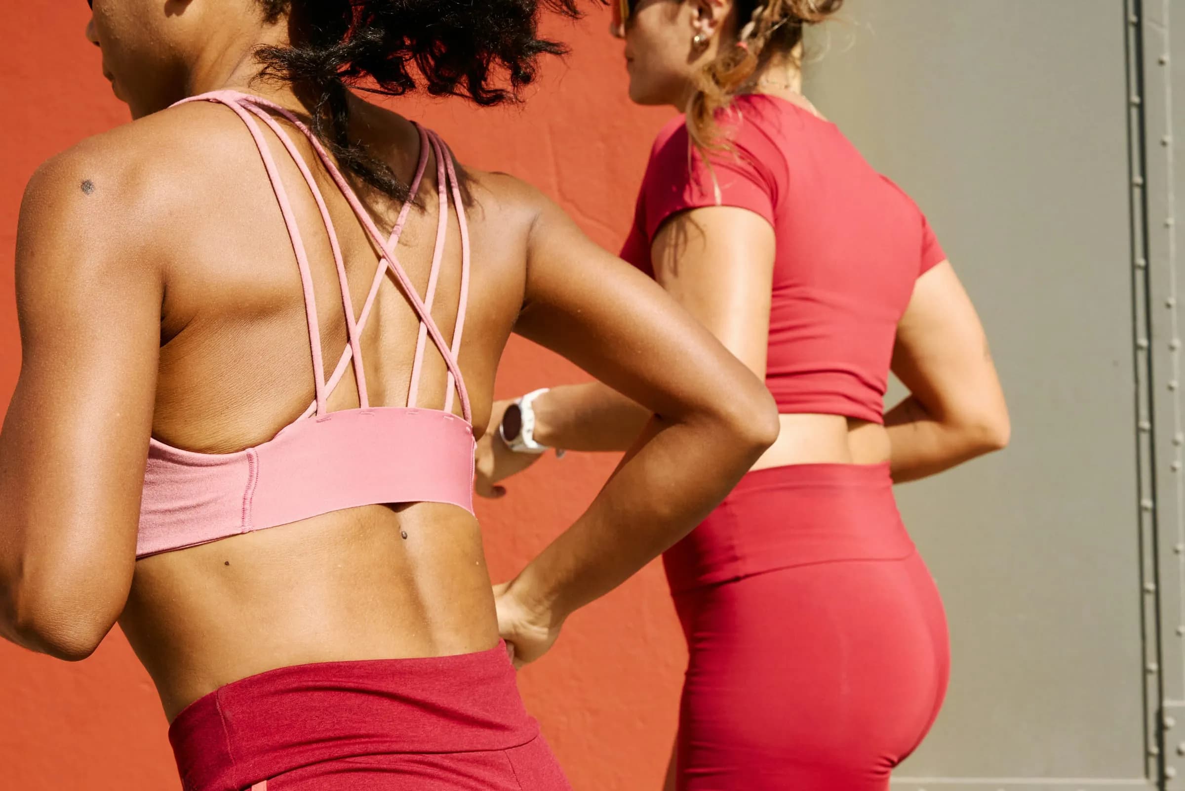 Two women in pink workout gear after training
