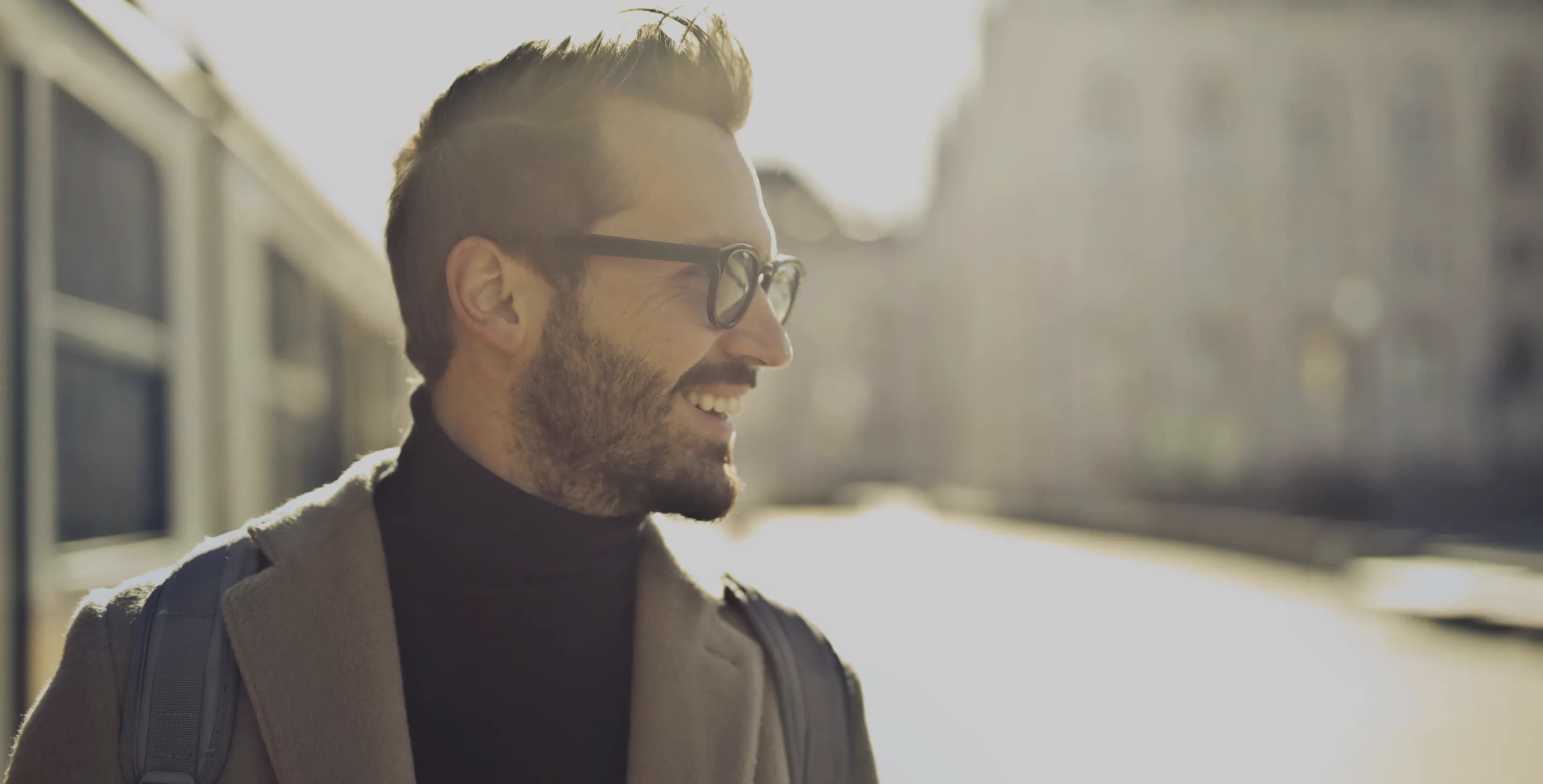 Man with glasses on a city street