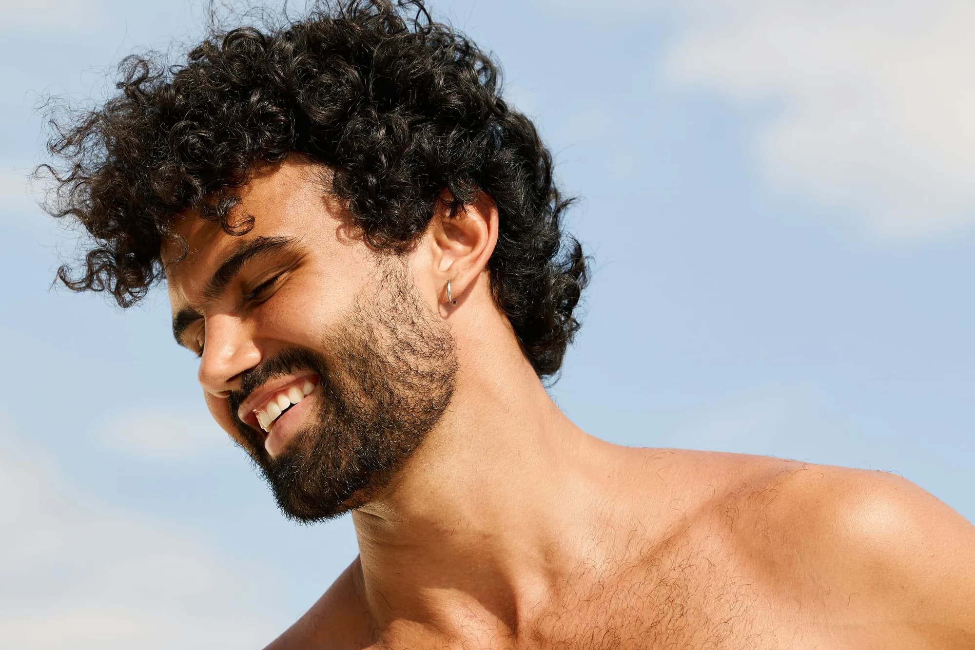 Man with full hair in soft daylight