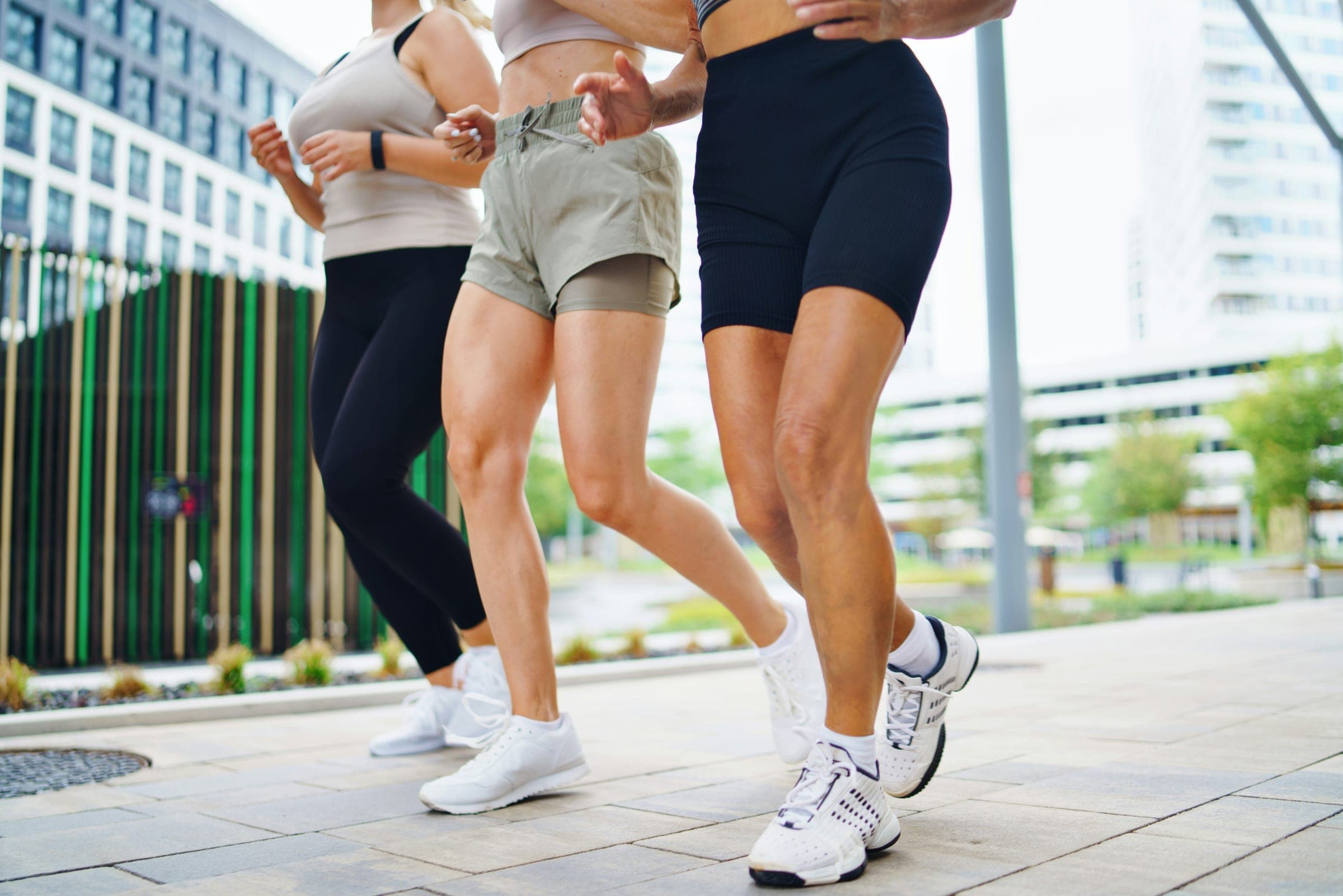 Three people jogging together outdoors