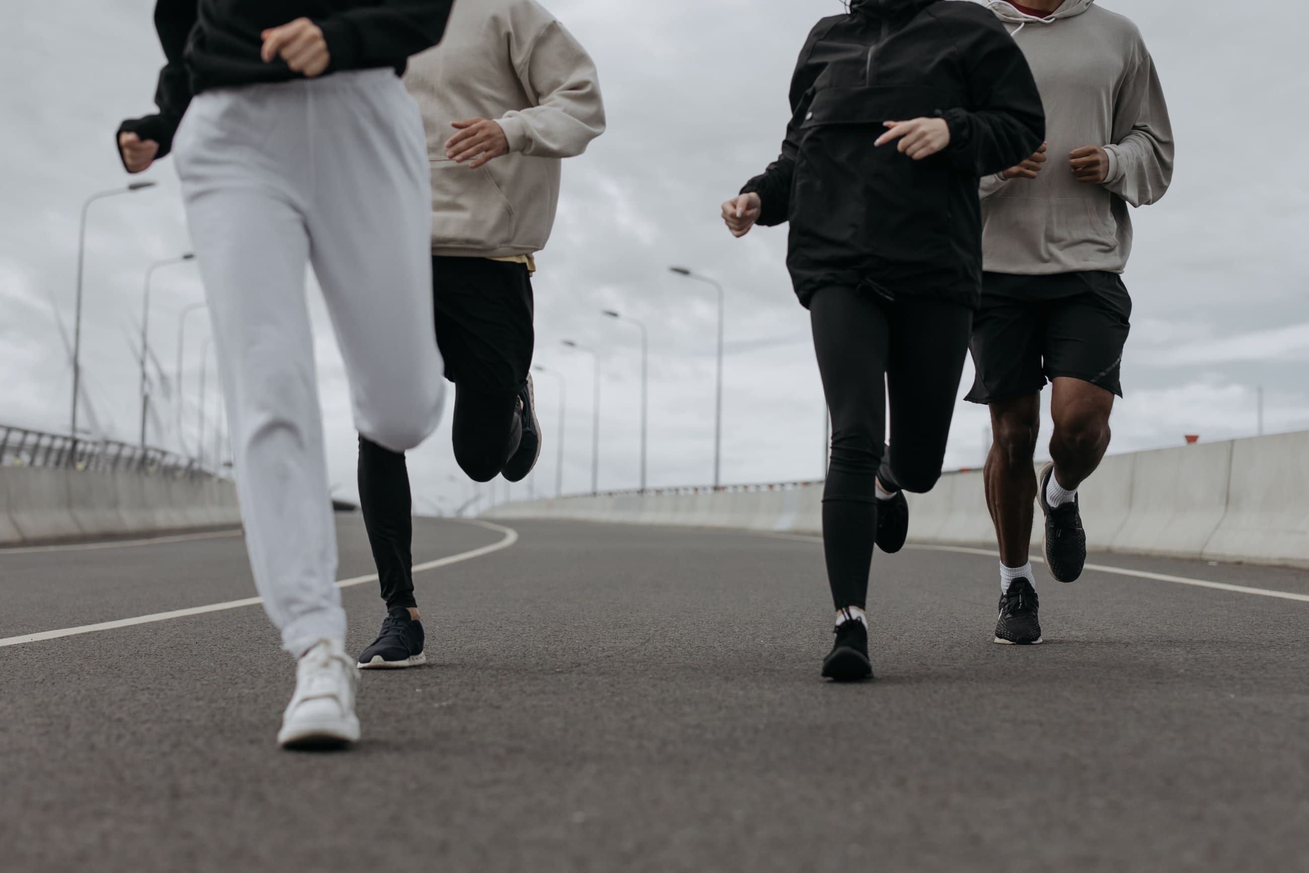 People running on an outdoor road