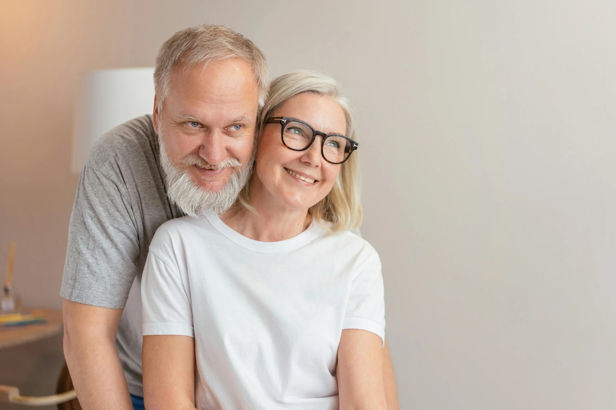 Older couple smiling together at home